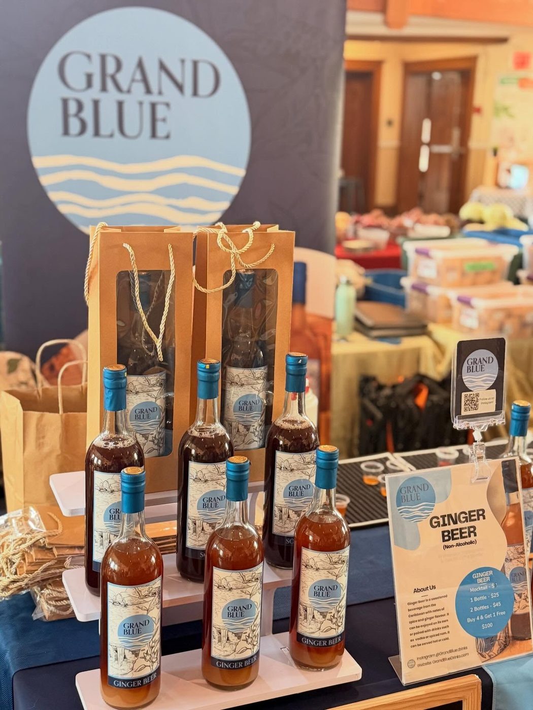 Grand Blue Sorrel and Ginger Beer bottles arranged across a Toronto market stall